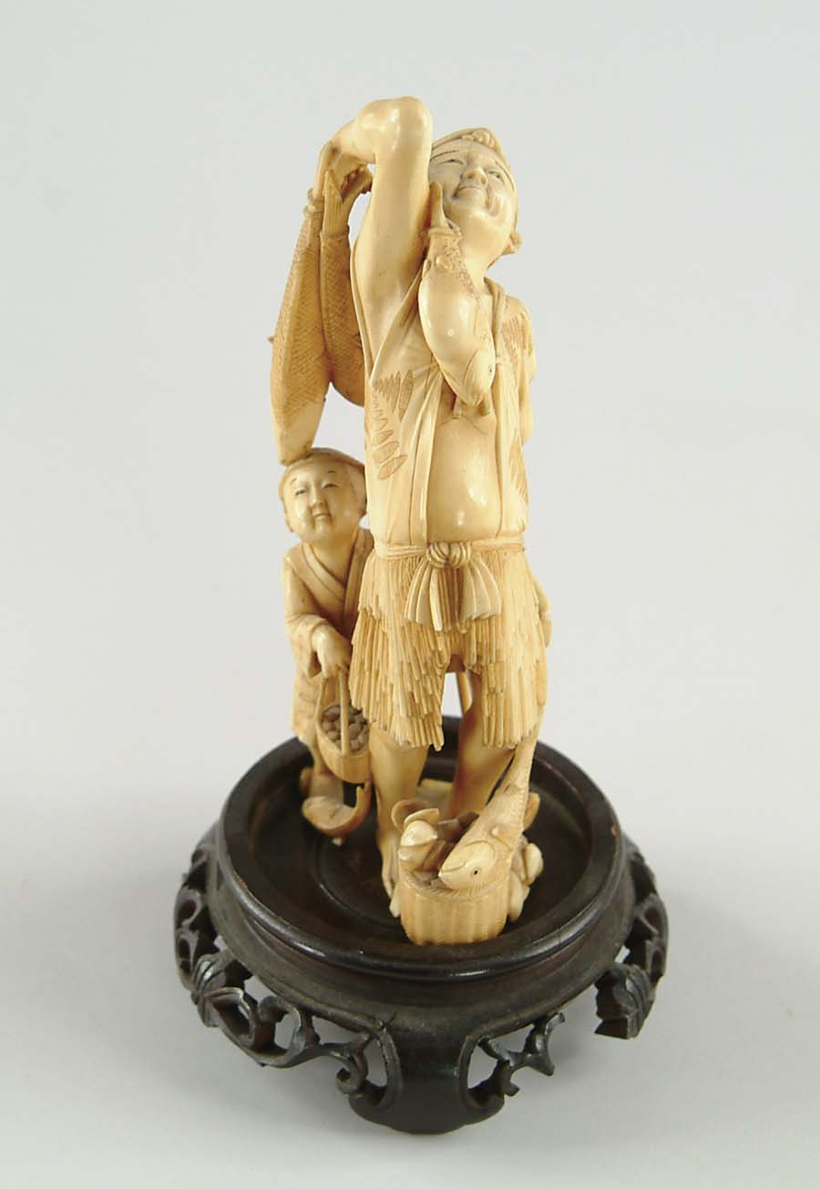 Appraisal: FINE ANTIQUE IVORY CARVING OF A MAN AND BOY WITH