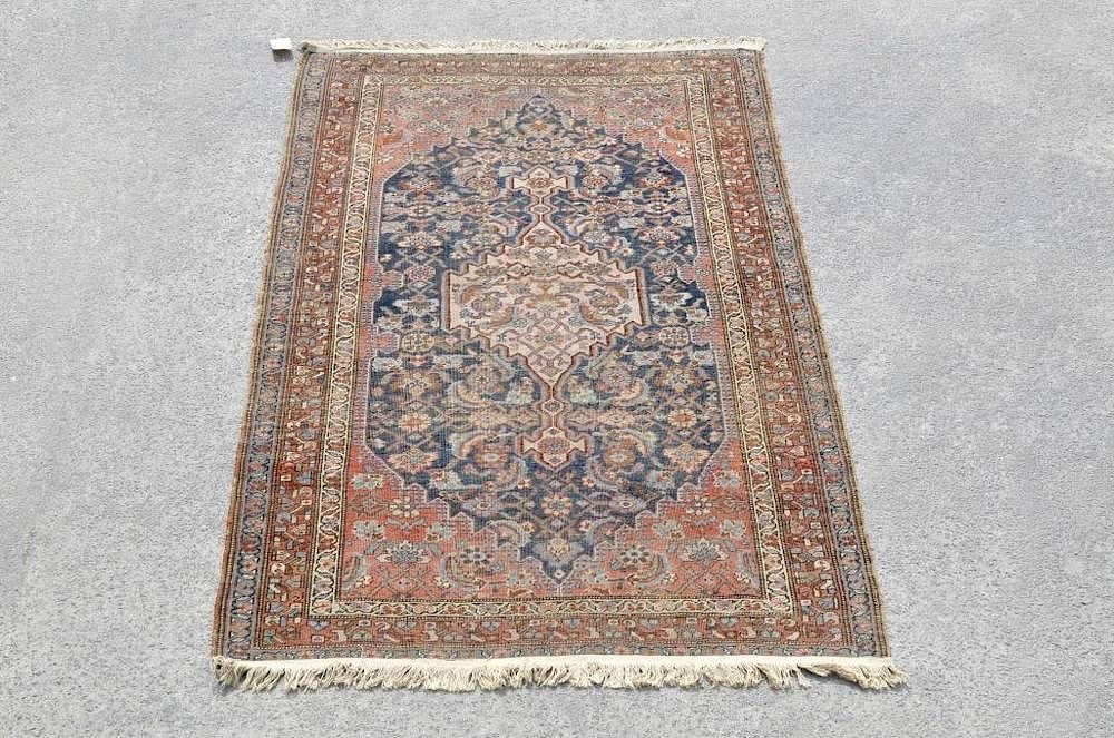 Appraisal: Persian Area Rug Persian rug in shades of blue and