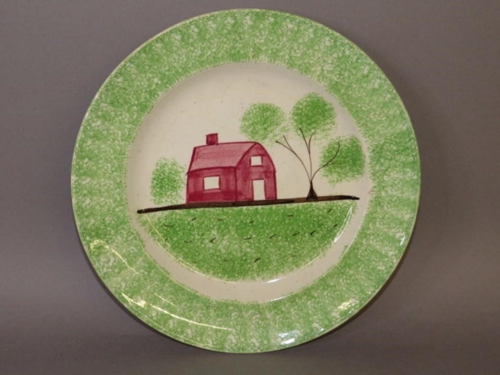 Appraisal: GREEN SPATTER RED SCHOOLHOUSE PATTERN PLATEca with brown tree and