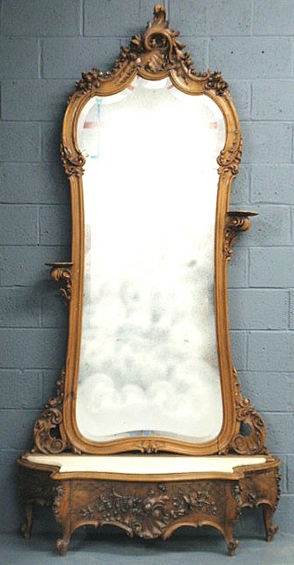 Appraisal: French walnut pier mirror with heavy carvings beveled glass and