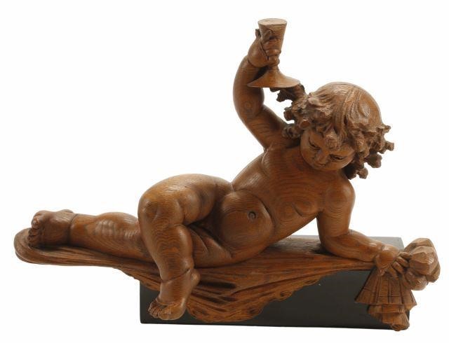 Appraisal: Italian carved wood figure of a putto th c in