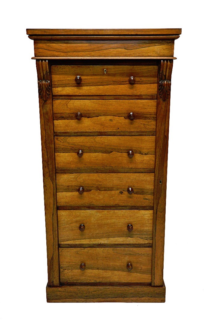 Appraisal: A th century rosewood Wellington chest the six graduated drawers