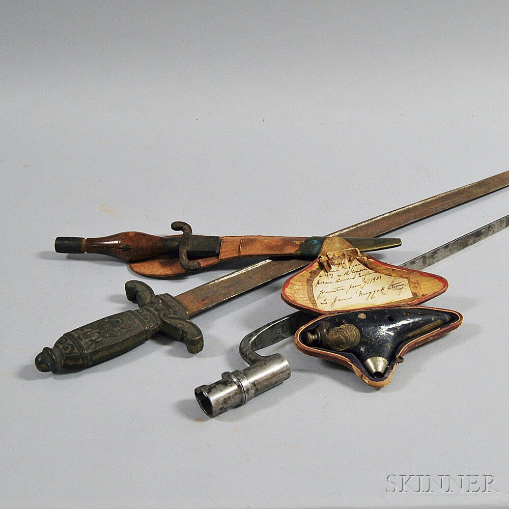 Appraisal: Three Weaponry Items a dagger with brass-mounted leather scabbard a