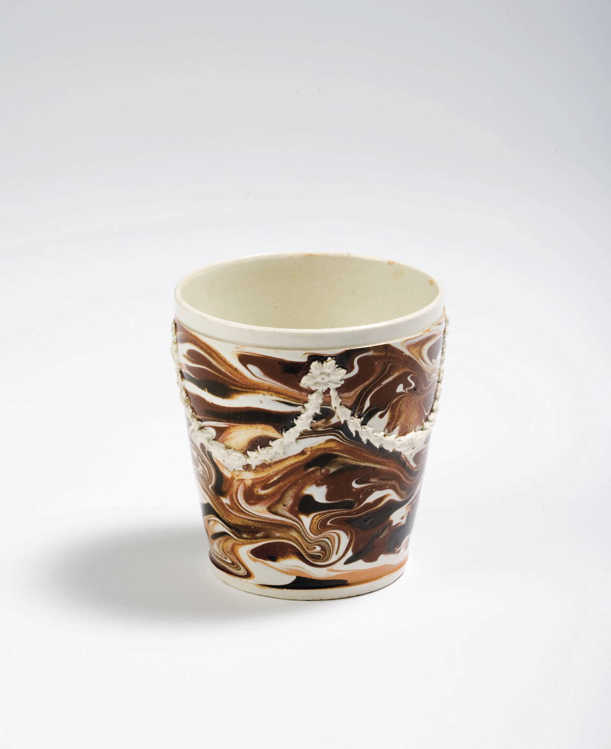 Appraisal: BRITISH PEARLWARE MOCHAWARE BEAKER CIRCA Slip-marbled in dark brown brown