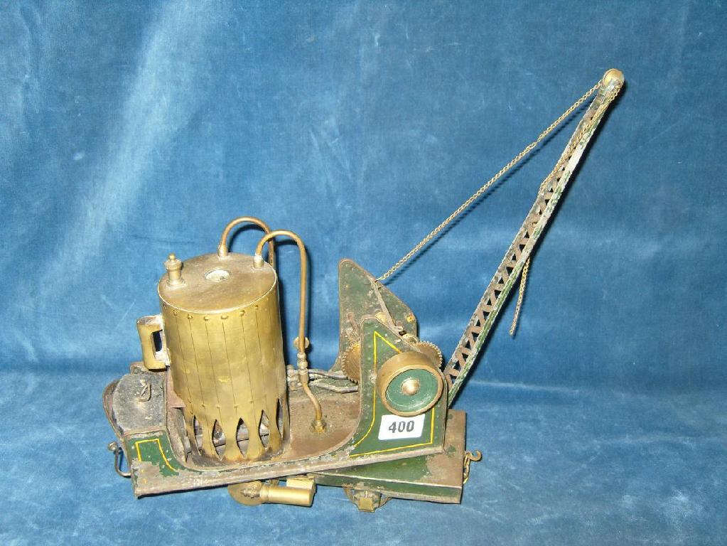 Appraisal: An early th century tin plate steam operated mobile crane