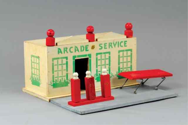 Appraisal: ARCADE WOOD SERVICE STATION Painted in white with green stenciled