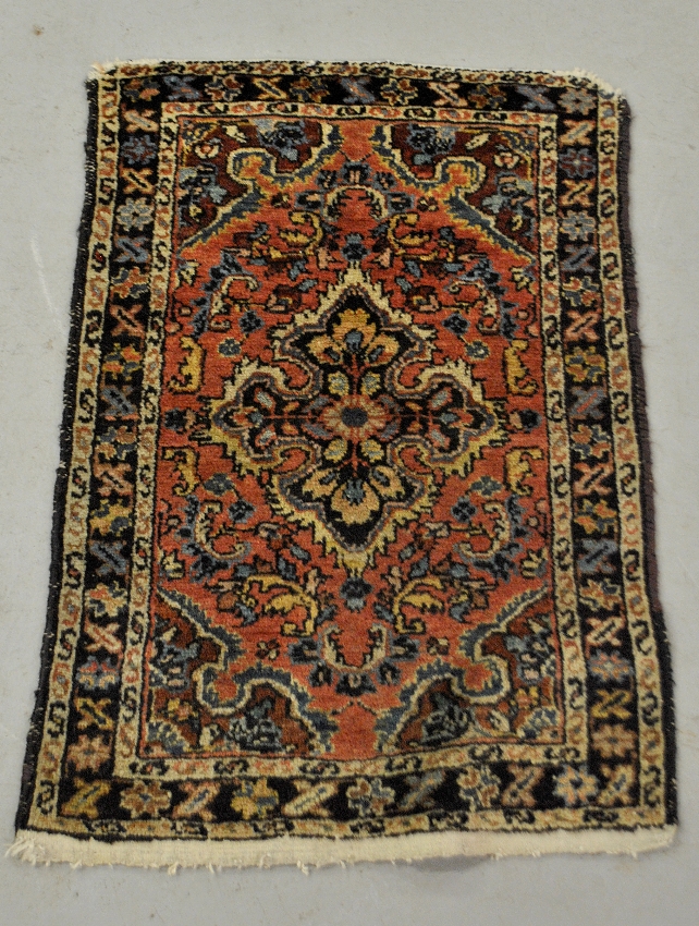 Appraisal: - Hamadan oriental throw mat with red field and overall