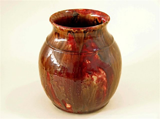 Appraisal: JOHN CAMPBELL BALUSTER VASE BURGUNDY AND BROWN DRIP GLAZE