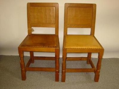 Appraisal: TWO SIMILAR ADZED OAK DINING CHAIRS by Robert Mouseman Thompson