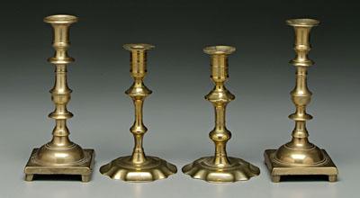 Appraisal: Four brass candlesticks one pair with heavy square bases baluster