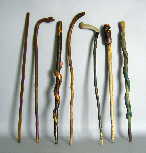 Appraisal: Six carved canes together with a yard stick