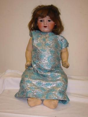 Appraisal: An Armand Marseille bisque head girl doll with brown glass