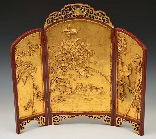 Appraisal: A CHINESE CARVED WOOD FOLDING TABLE SCREEN with a gilt