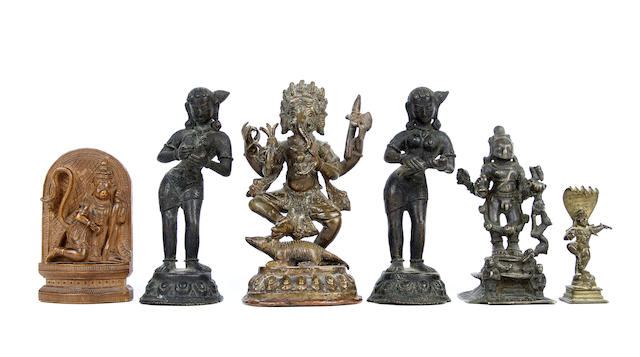 Appraisal: Five Himalayan bronze figures and a wood sculpture Including a