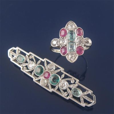 Appraisal: A bar brooch set with four diamonds four emeralds and