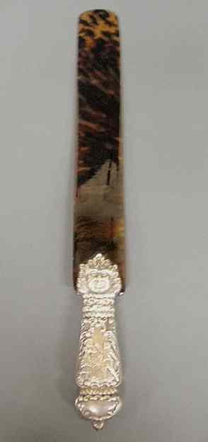 Appraisal: English silver and tortoiseshell page turner c the silver handle