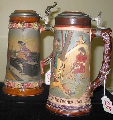 Appraisal: TWO GERMAN POTTERY BEER STEINS in the manner of Mettlach