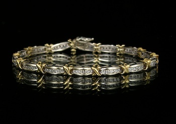 Appraisal: A Two-Tone Gold and Diamond Bracelet k yellow and white