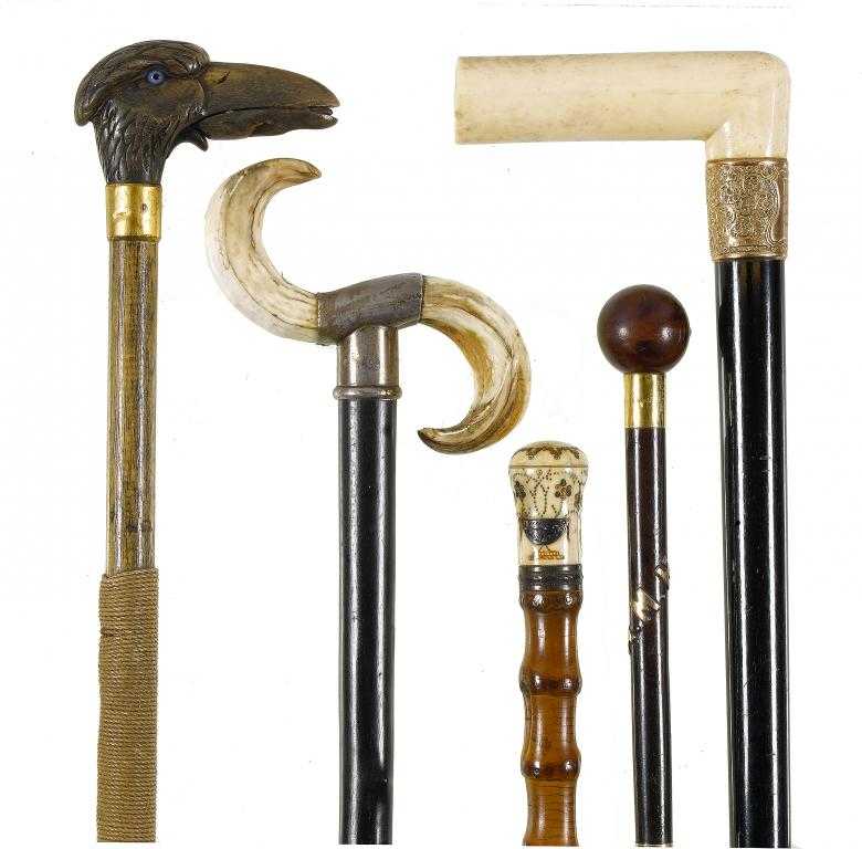 Appraisal: A CARVED HORN-HANDLED WALKING CANE the handle in the form