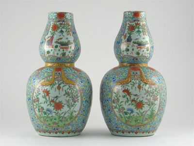 Appraisal: A pair of Chinese famille rose gourd-shaped vases painted with