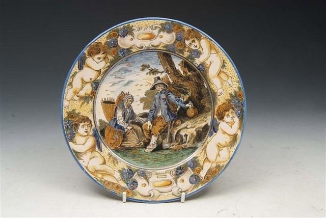 Appraisal: A CASTELLI POLYCHROME POTTERY SMALL PLATE painted to the centre