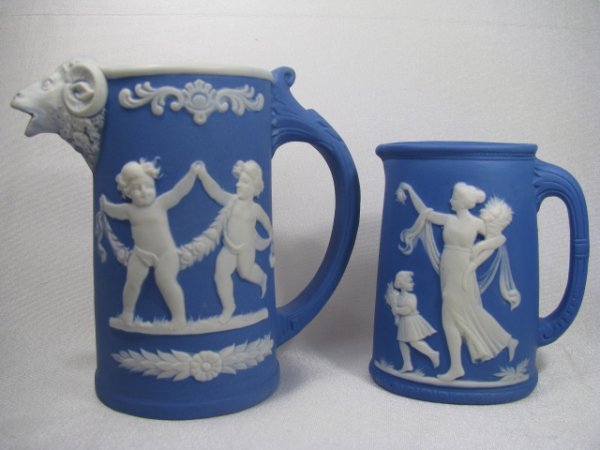 Appraisal: Two blue with white cameo relief Jasper ware type creamers