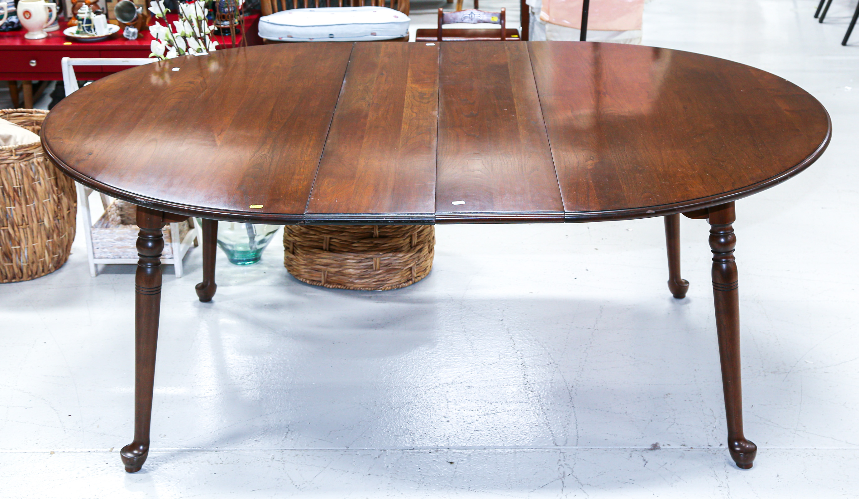 Appraisal: QUEEN ANNE STYLE CHERRY DINING TABLE With two leaves in