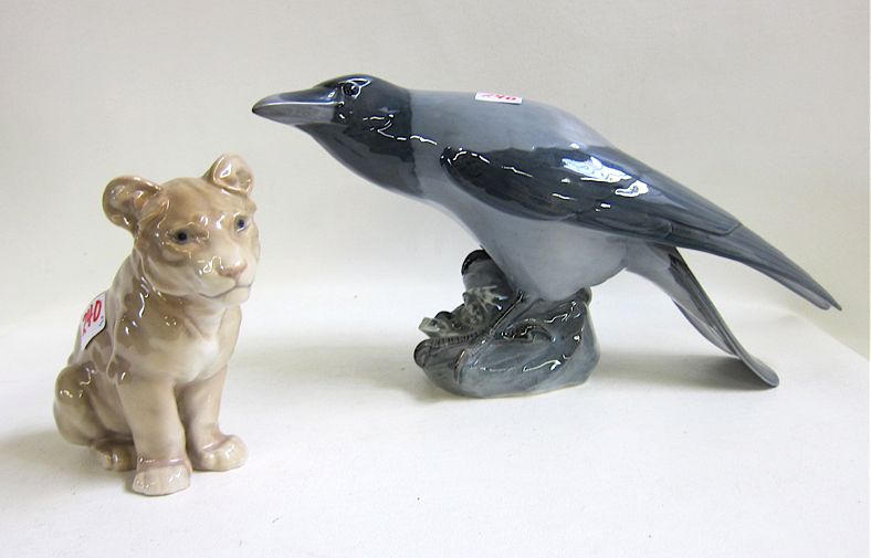 Appraisal: TWO DANISH PORCELAIN WILDLIFE FIGURES Bing Grondahl lion cub H