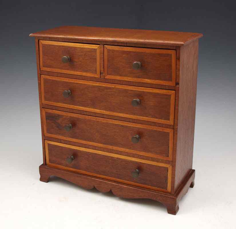 Appraisal: MINIATURE BANDED MAHOGANY CHEST half drawers over full drawers ''