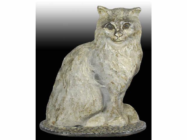 Appraisal: Sitting Cat on Braided Rug Cast Iron Doorstop Description National