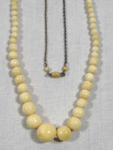 Appraisal: A graduated ivory bead necklace the beads graduated from approx