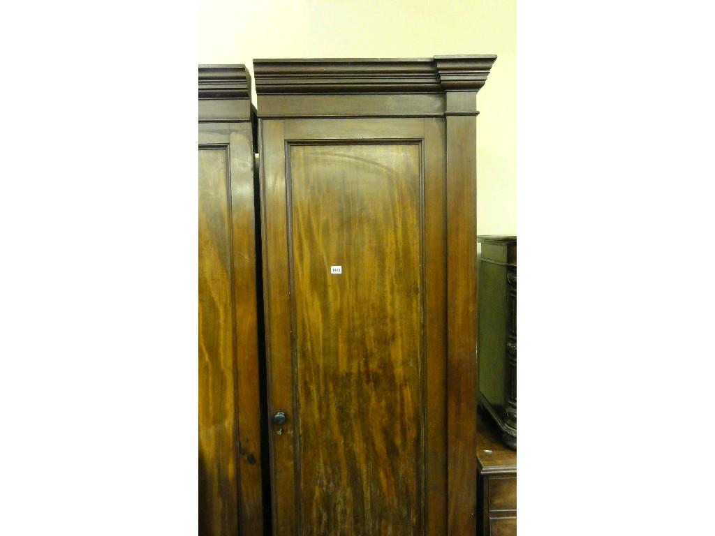 Appraisal: A th century mahogany wardrobe enclosed by a pair of