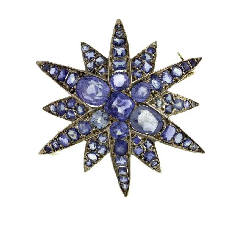 Appraisal: A SAPPHIRE STAR BROOCH of twelve points with cushion shaped