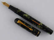 Appraisal: An R Esterbrook Co Relief fountain pen in mottled green