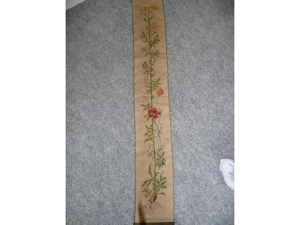 Appraisal: In needlepoint - a vintage wall hanging with a poppy