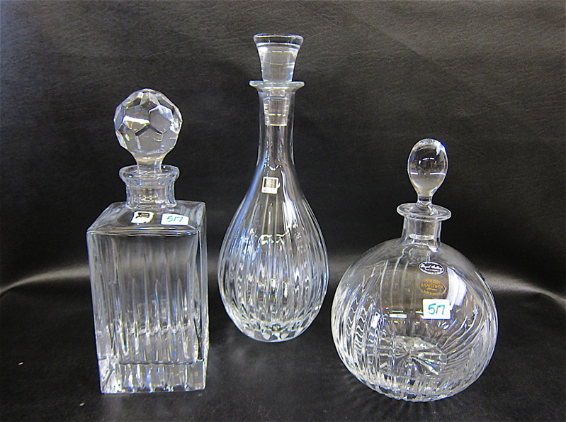 Appraisal: THREE CRYSTAL STOPPED BOTTLES of various forms Two marked Miller