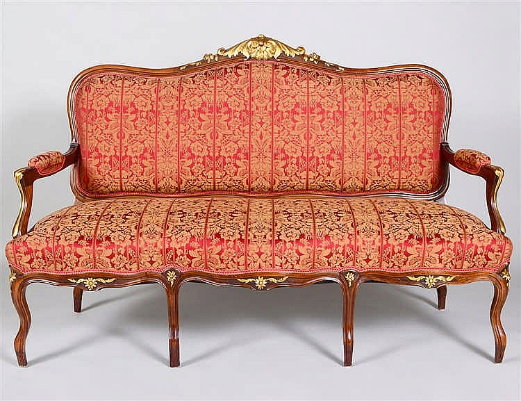 Appraisal: LOUIS XV STYLE PARCEL GTILT CARVED WALNUT SETTEEThe padded serpentine