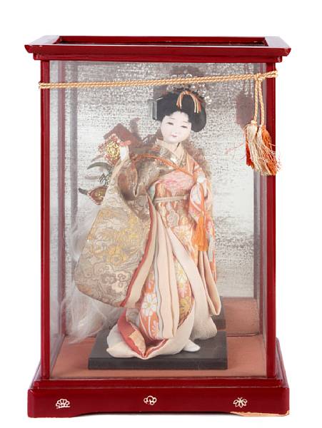 Appraisal: A Japanese doll in a display case display case height