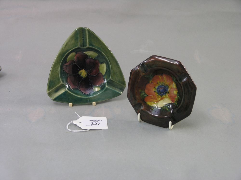 Appraisal: Two Moorcroft ashtrays one octagonal Anemone pattern the other triangular