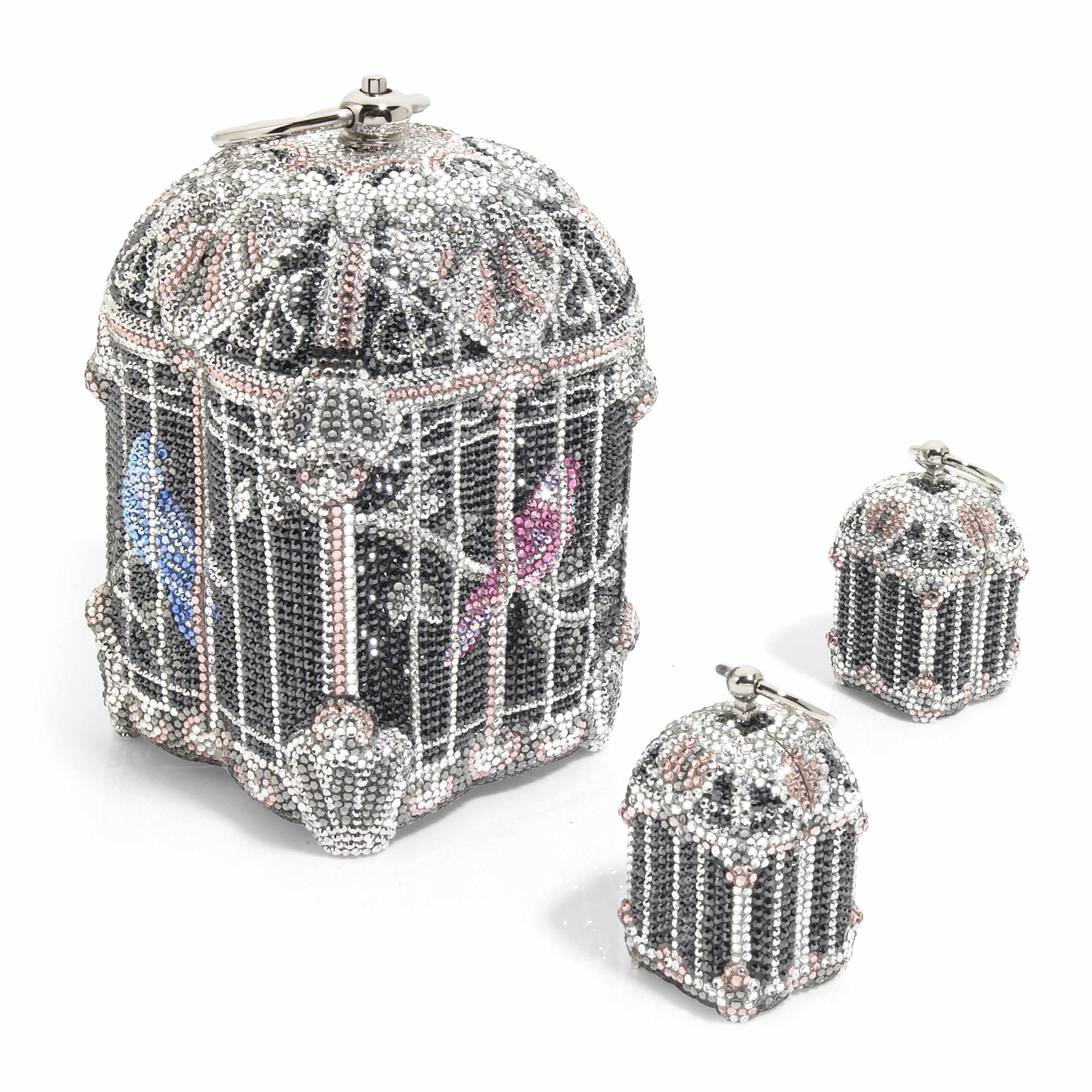 Appraisal: A black silver and pink crystal nightingale birdcage minaudiere with