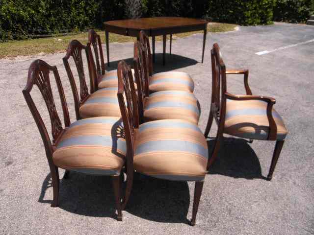 Appraisal: Seven carved Mahogany dining chairs Red blue tan striped upholstery