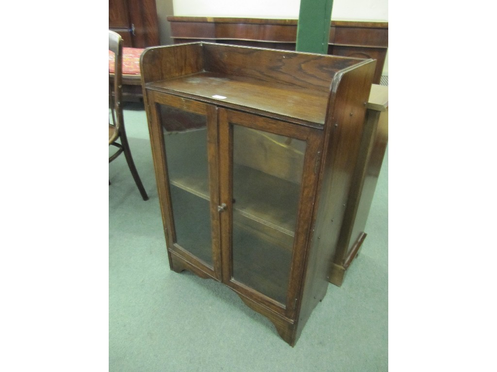 Appraisal: Oak glazed two door bookcase