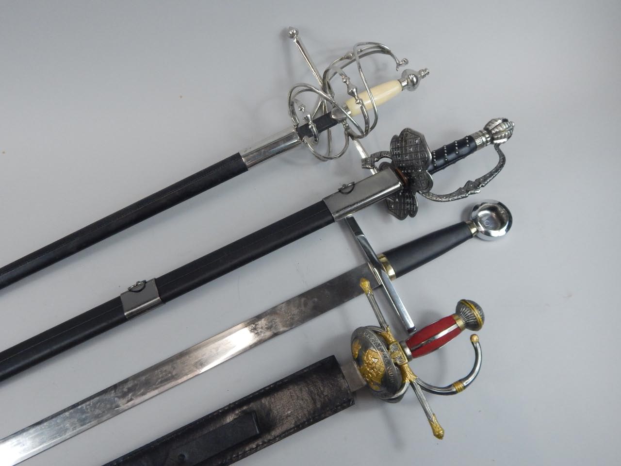 Appraisal: A collection of replica bladed weaponry comprising four swords including