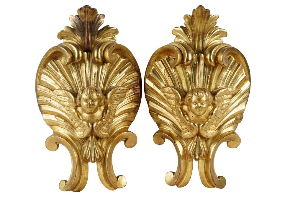 Appraisal: PAIR GILTWOOD DECORATIVE ELEMENTSeach curved panel carved with the head