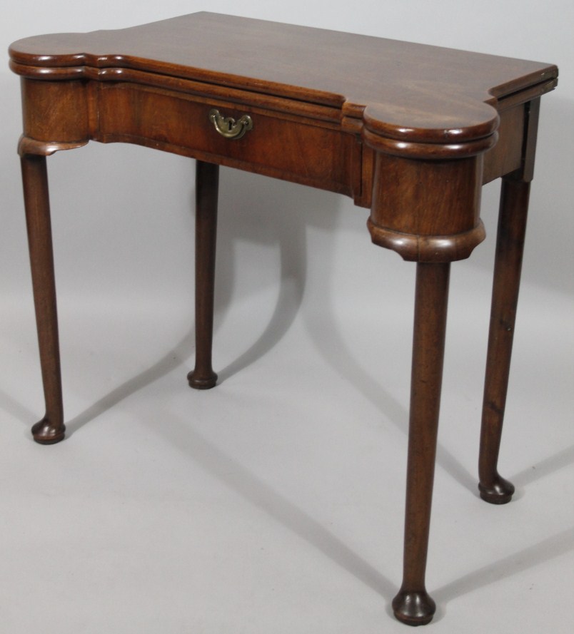 Appraisal: A George III mahogany fold over games table with concertina