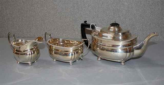 Appraisal: A THREE PIECE SILVER TEA SET oval teapot with gadrooned