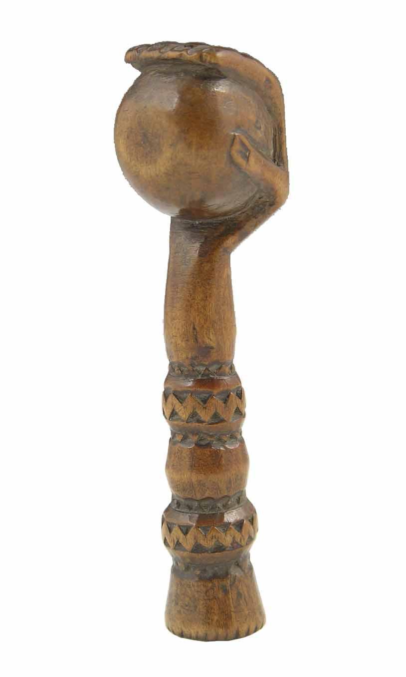 Appraisal: A mid th century carved treen pipe tamper