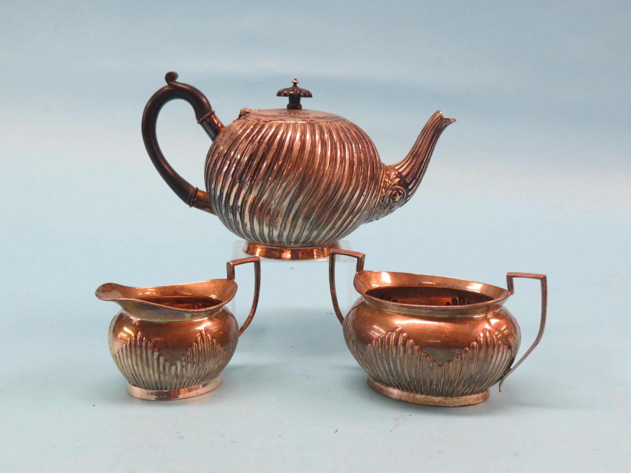 Appraisal: A Victorian silver teapot globular wrythen form with hardwood handle