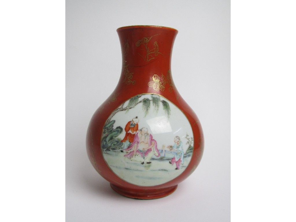 Appraisal: A Chinese red ground baluster vase painted with two panels