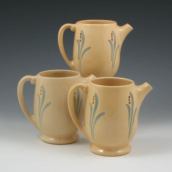 Appraisal: Three Roseville Utility pint pitchers with lily of the valley